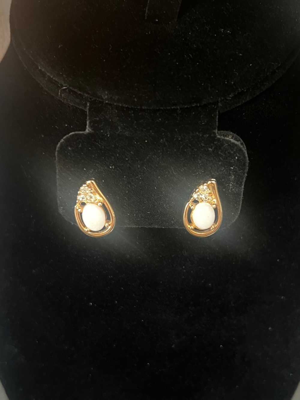 Gold-Tone Earrings with an oval white stone accented by crystal stones